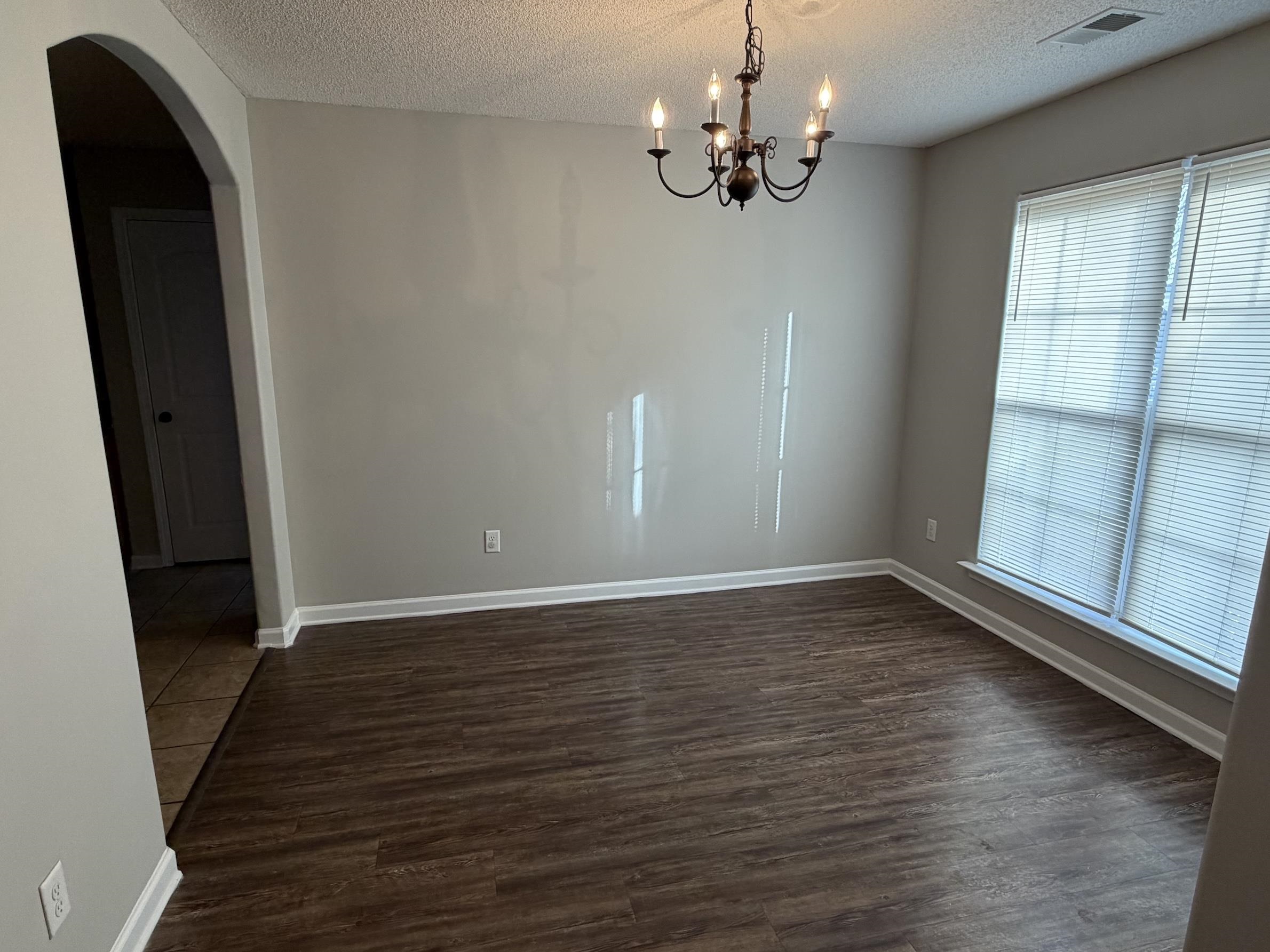 8712 Edney Ridge Drive Cordova, TN 38016 - Photo 14 of 18 wooden floor in an empty room with a window