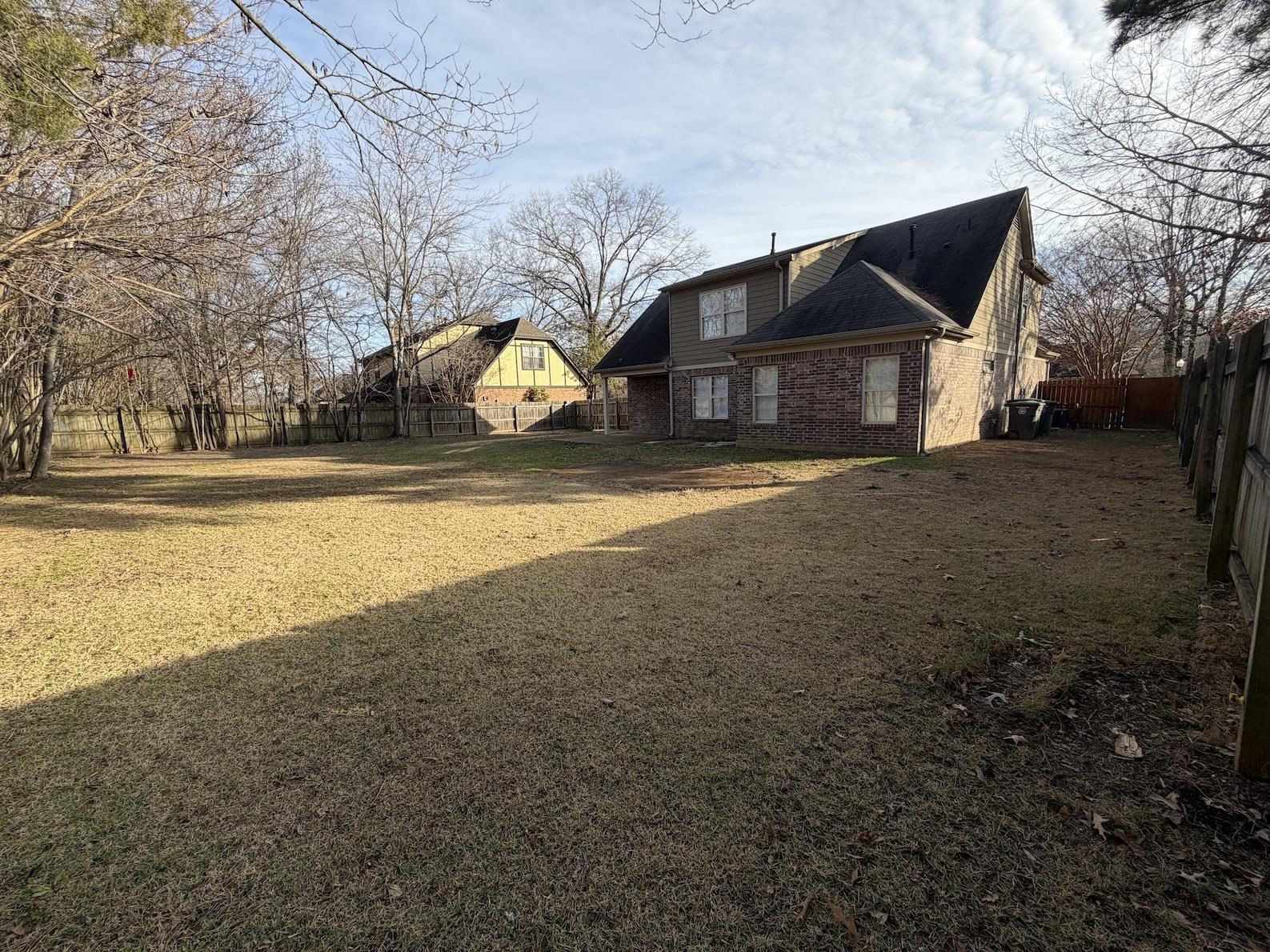 8712 Edney Ridge Drive Cordova, TN 38016 - Photo 15 of 18 a front view of house with yard and trees in the background
