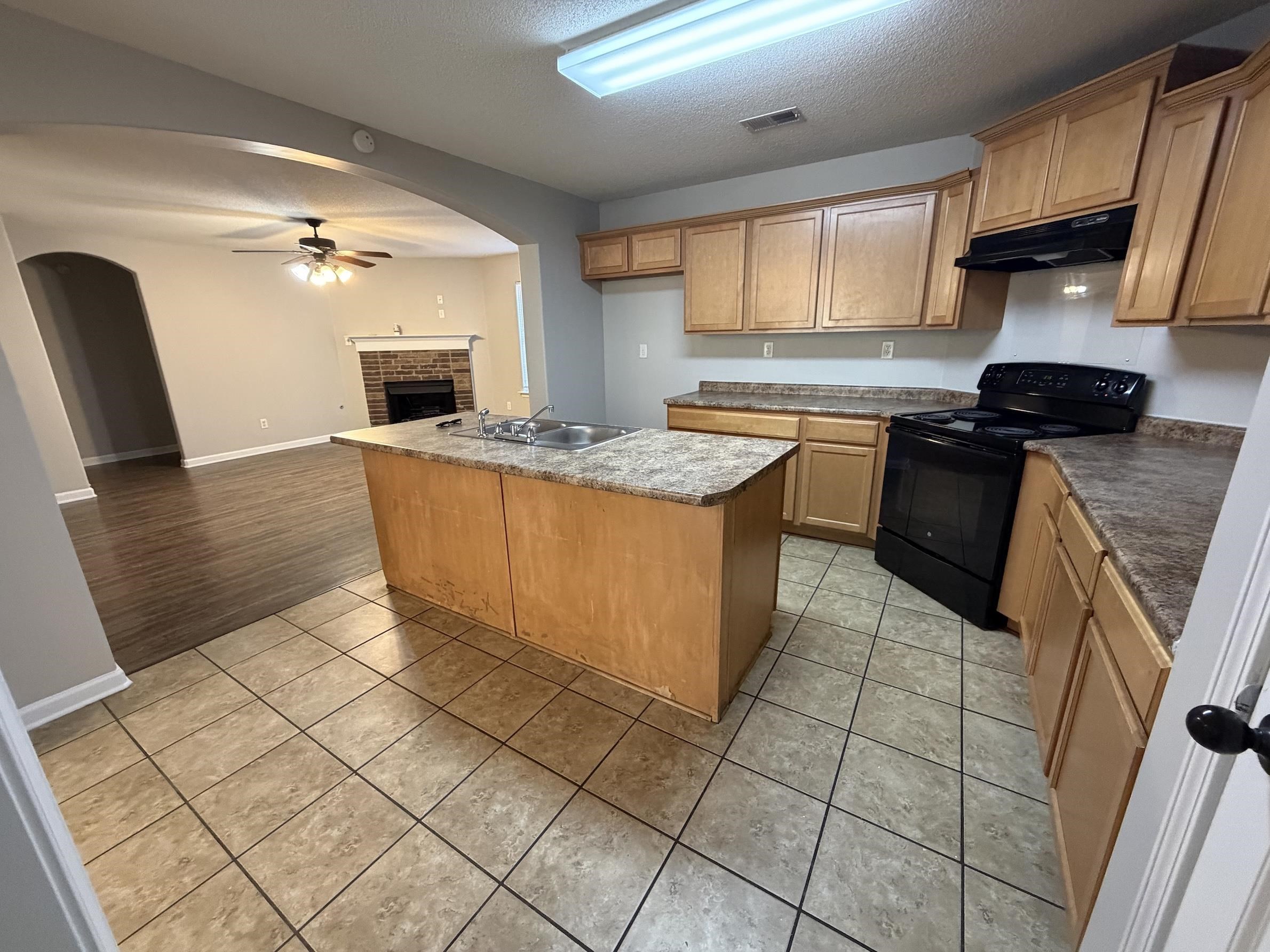 8712 Edney Ridge Drive Cordova, TN 38016 - Photo 2 of 18 a kitchen with stainless steel appliances granite countertop a stove a sink and a microwave