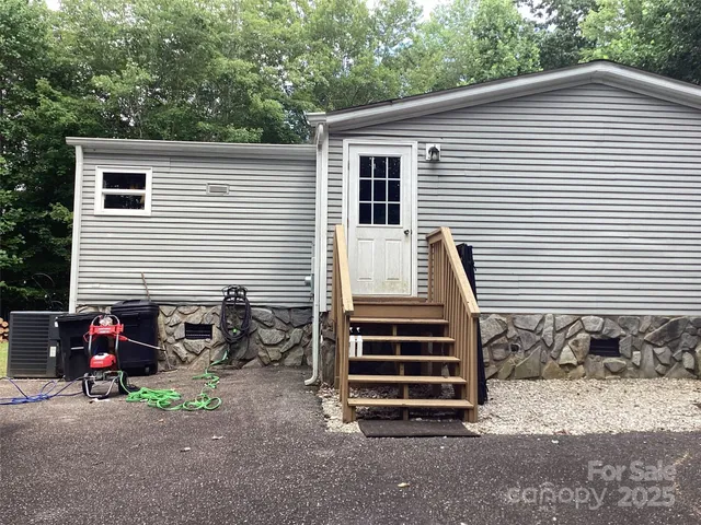 a view of a house with a yard and a large window