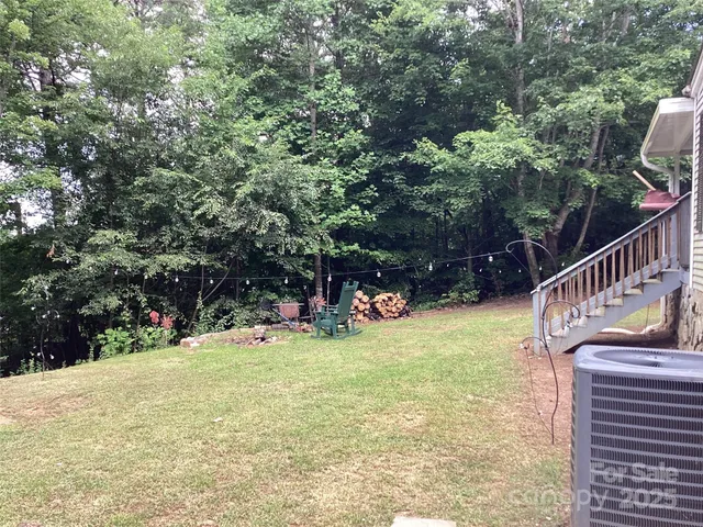 a view of a bench in a backyard