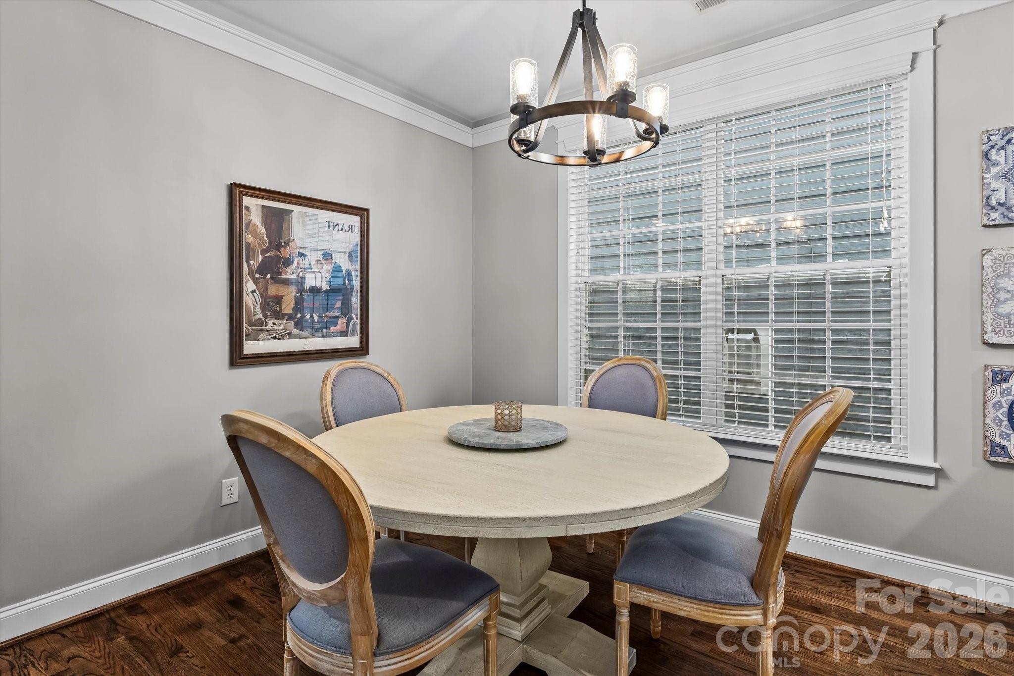 301 Bridges Farm Road Mooresville, NC 28115 - Photo 12 of 46 a view of a dining room with furniture window and wooden floor