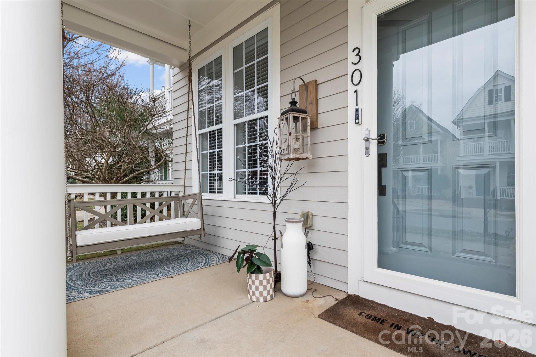 301 Bridges Farm Road Mooresville, NC 28115 - Photo 2 of 46 a view of a porch with a bench