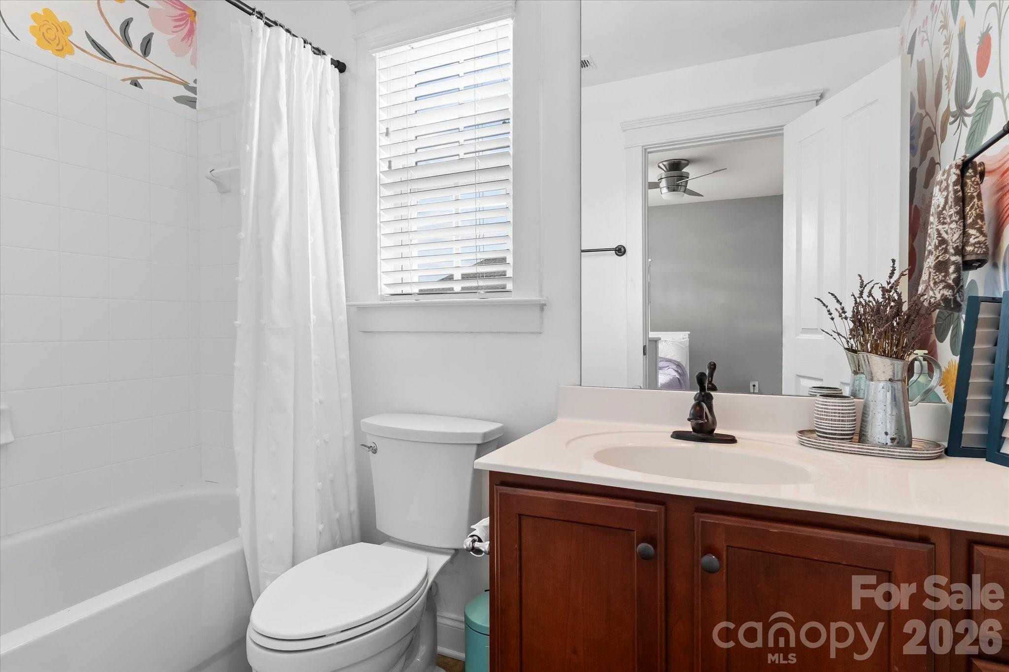 301 Bridges Farm Road Mooresville, NC 28115 - Photo 22 of 46 a bathroom with a sink a toilet and tub