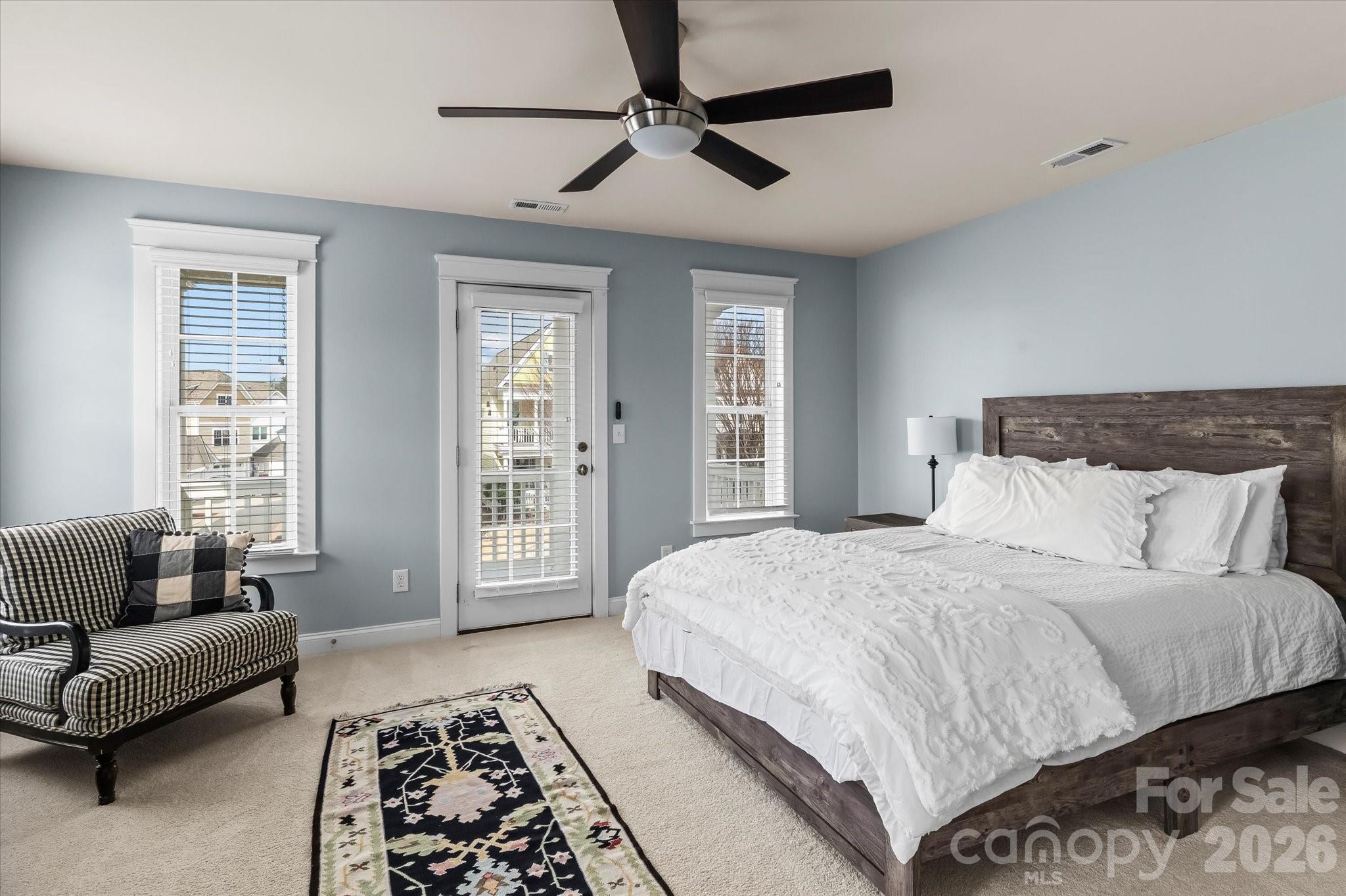 301 Bridges Farm Road Mooresville, NC 28115 - Photo 23 of 46 a bedroom with a bed couch and a window