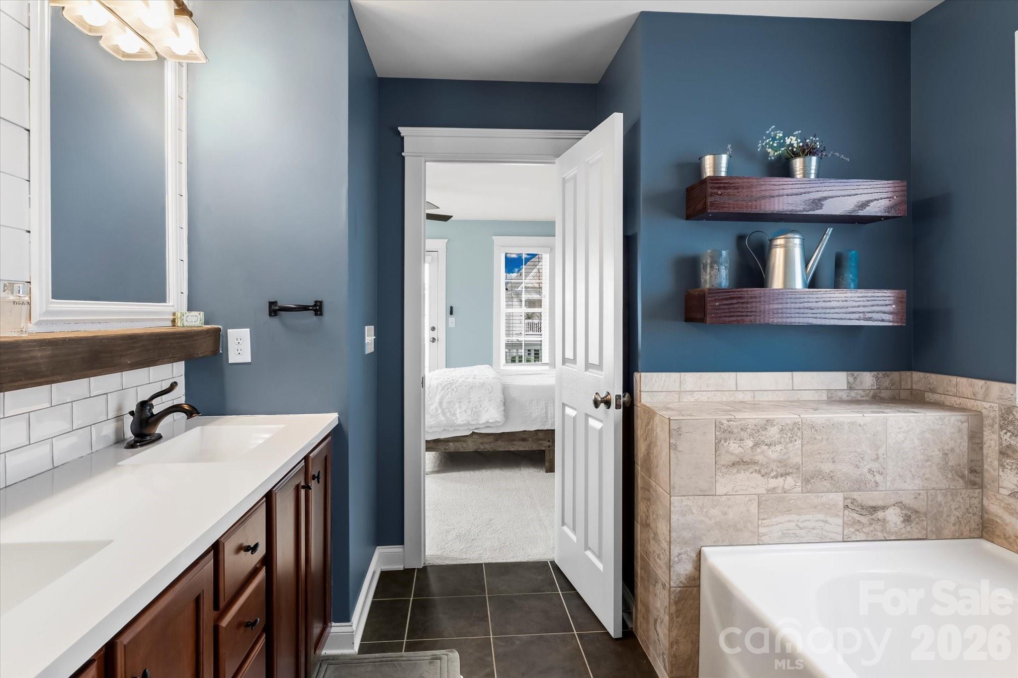 301 Bridges Farm Road Mooresville, NC 28115 - Photo 29 of 46 a bathroom with a sink and a mirror