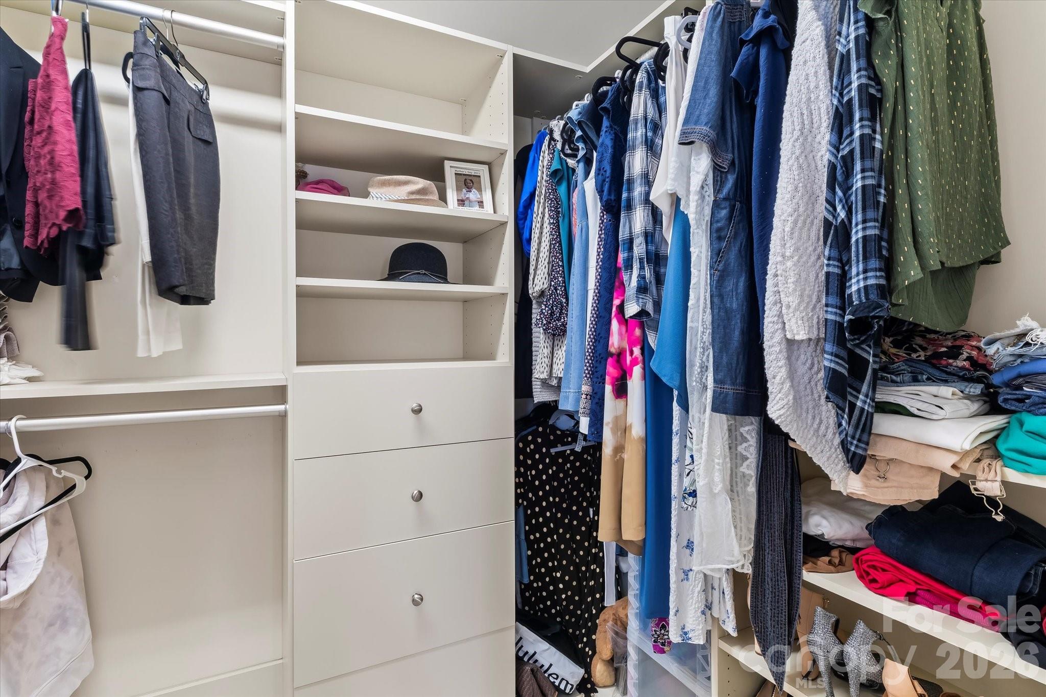 301 Bridges Farm Road Mooresville, NC 28115 - Photo 30 of 46 a view of walk in closet with clothes and shoes