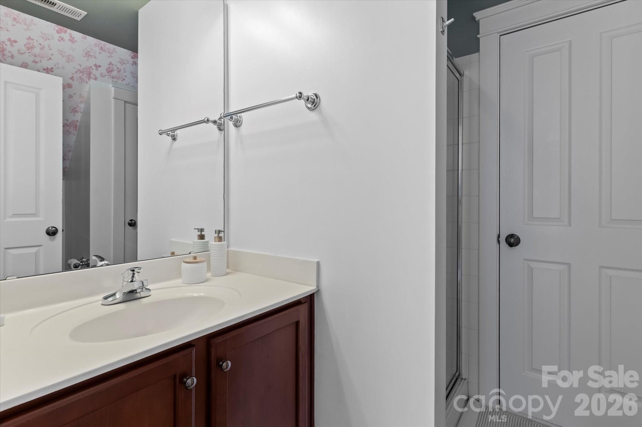 301 Bridges Farm Road Mooresville, NC 28115 - Photo 34 of 46 a bathroom with a sink and a mirror