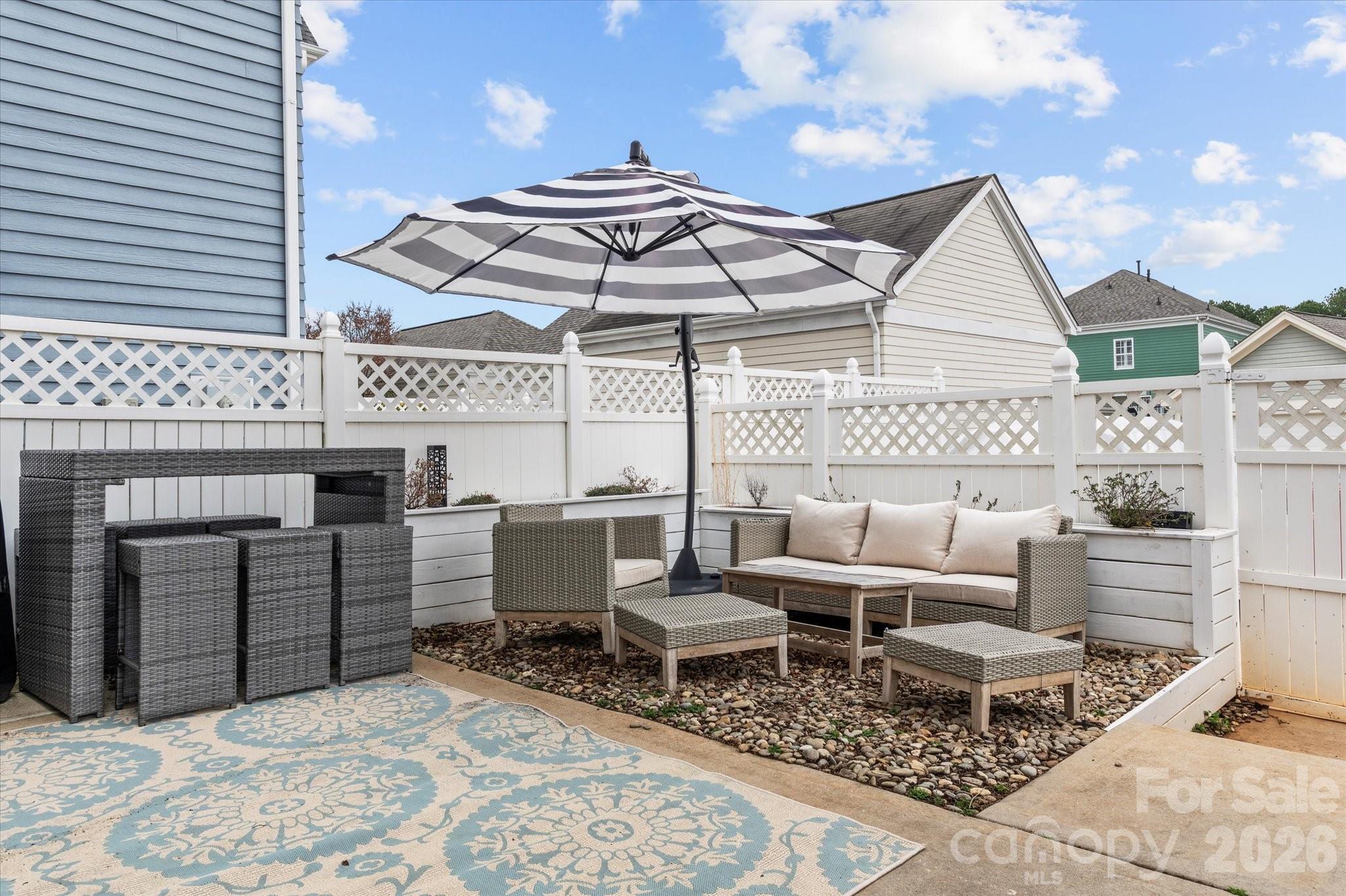 301 Bridges Farm Road Mooresville, NC 28115 - Photo 35 of 46 a view of a patio with a table and chairs