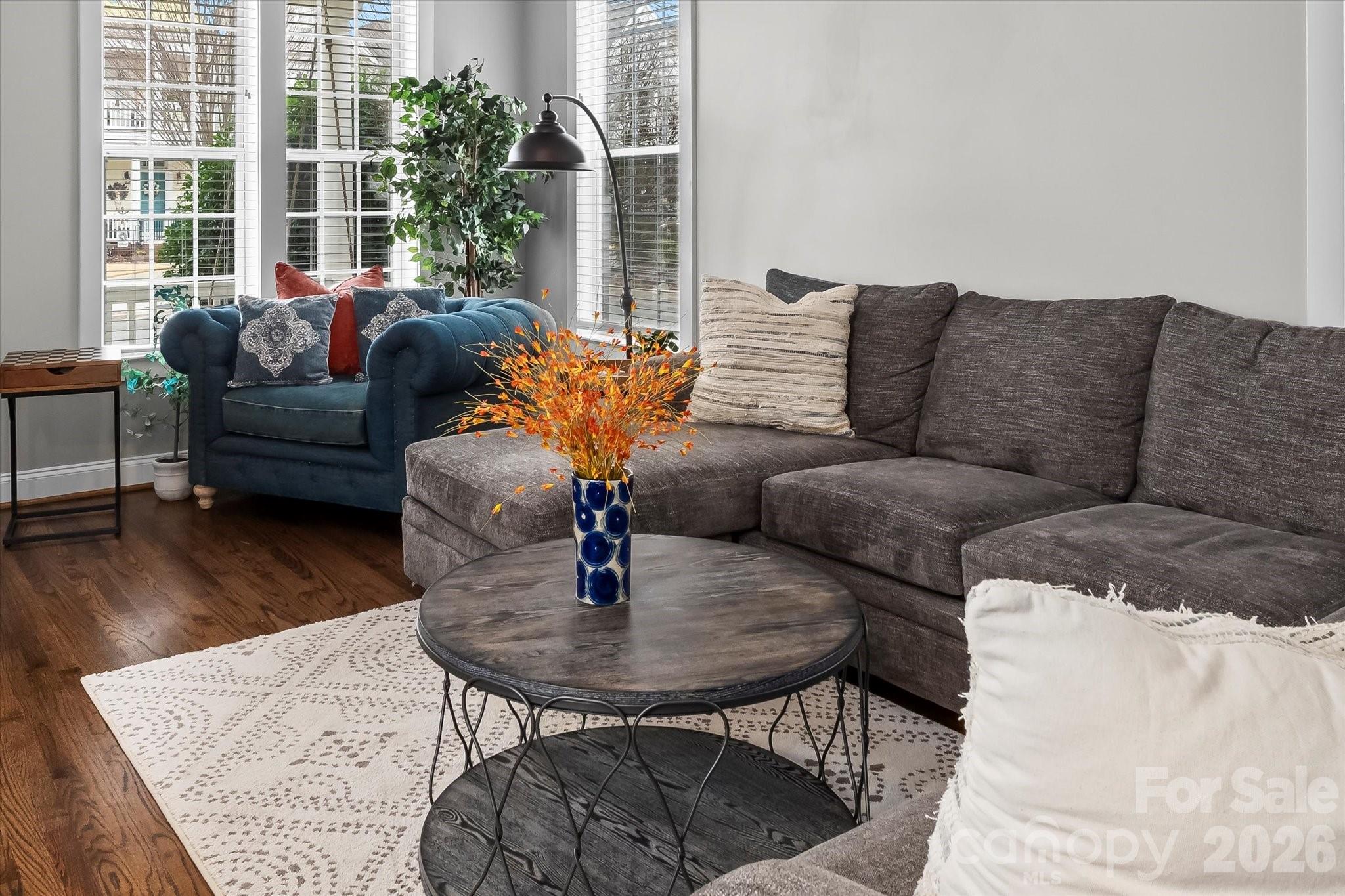 301 Bridges Farm Road Mooresville, NC 28115 - Photo 9 of 46 a living room with furniture and a potted plant