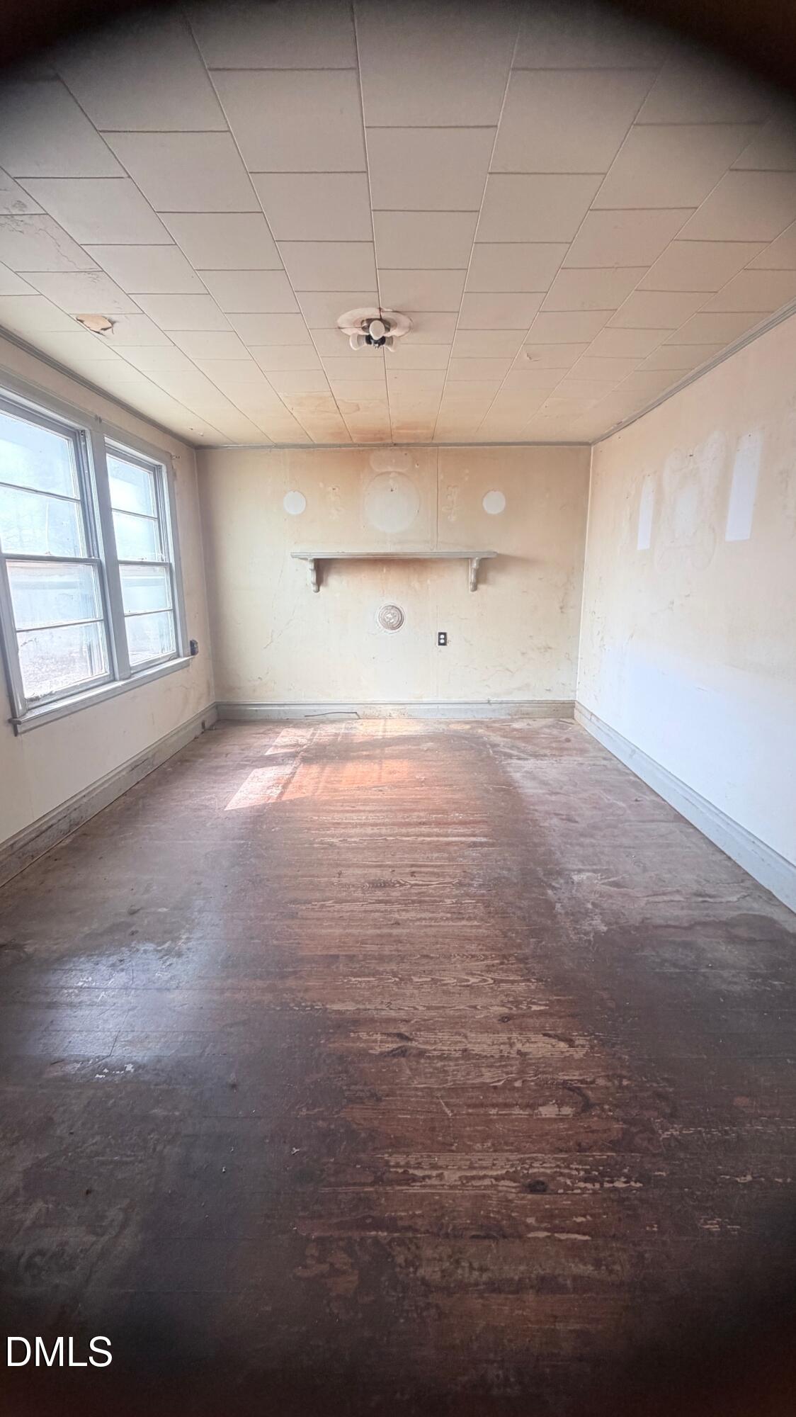 1352 Seays Road Liberty, NC 27298 - Photo 5 of 19 a view of empty room with wooden floor and fan