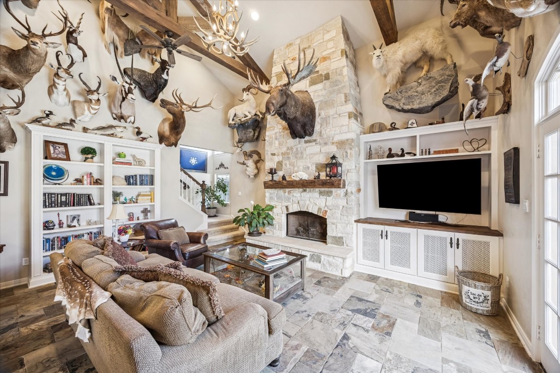 1502 Adkins Road Houston, TX 77055 - Photo 11 of 35 a living room with furniture a flat screen tv and a fireplace