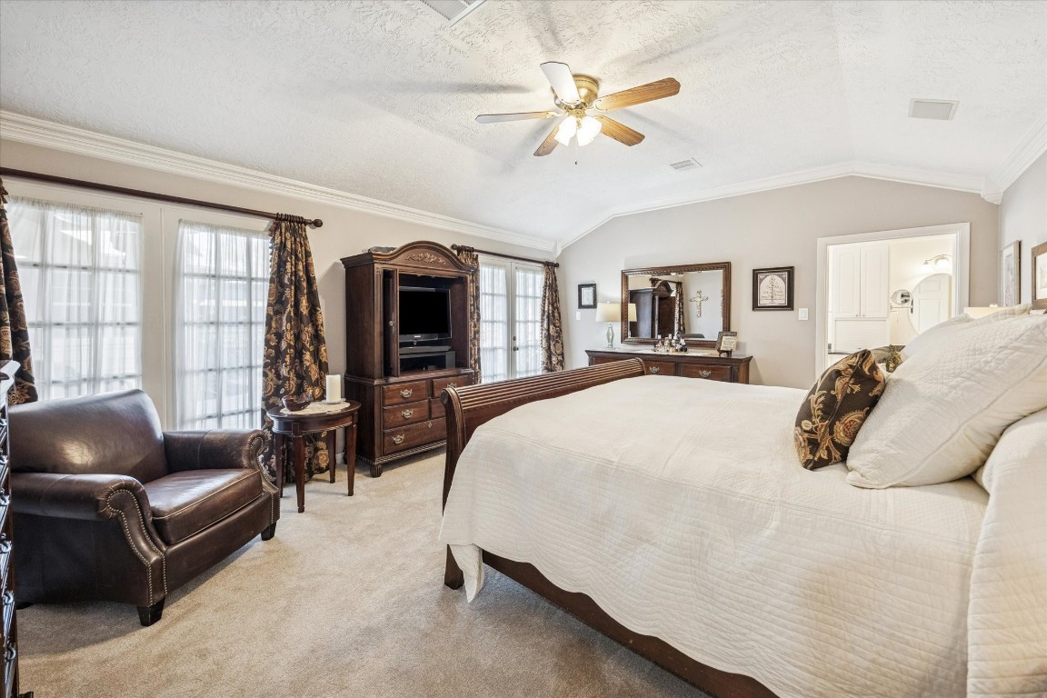 1502 Adkins Road Houston, TX 77055 - Photo 15 of 35 a spacious bedroom with a bed a couch and large window