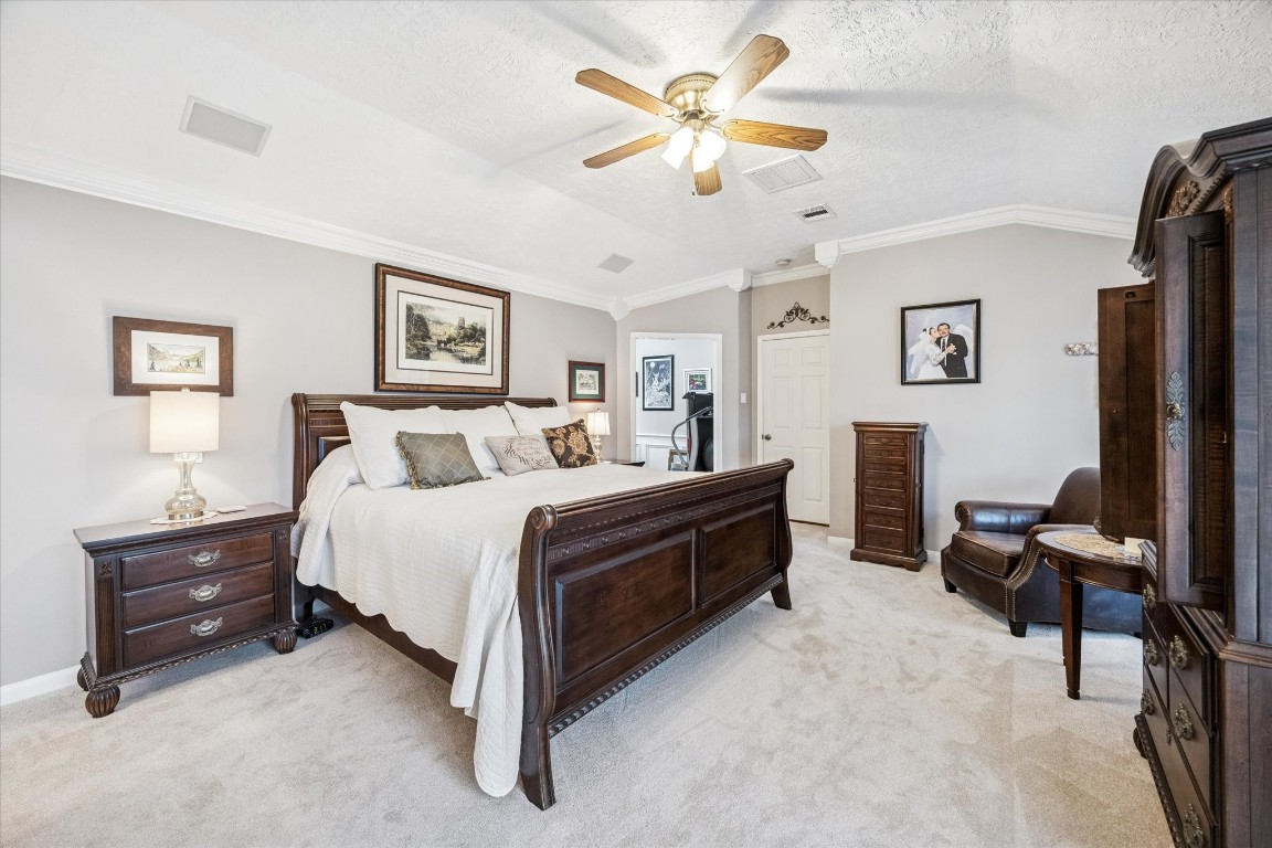 1502 Adkins Road Houston, TX 77055 - Photo 16 of 35 a bedroom with a bed dresser and a window