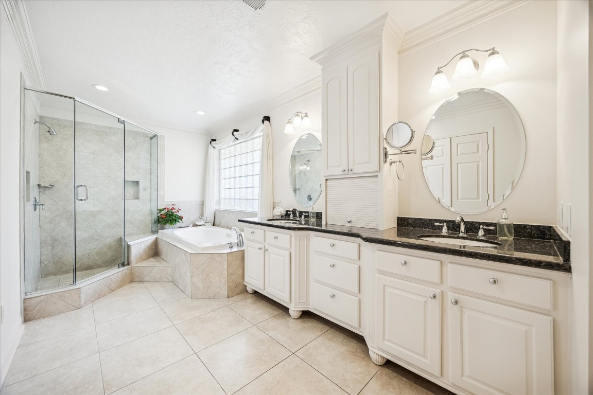 1502 Adkins Road Houston, TX 77055 - Photo 17 of 35 a spacious bathroom with a granite countertop sink mirror and a