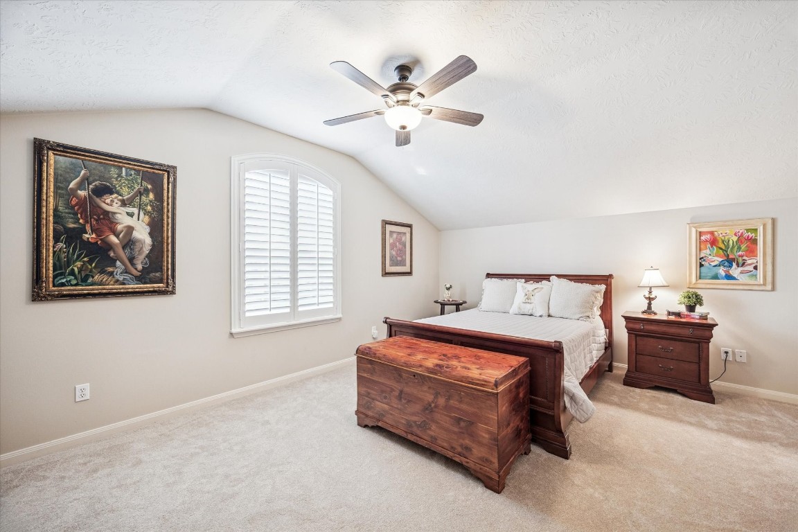 1502 Adkins Road Houston, TX 77055 - Photo 19 of 35 a spacious bedroom with a bed and window