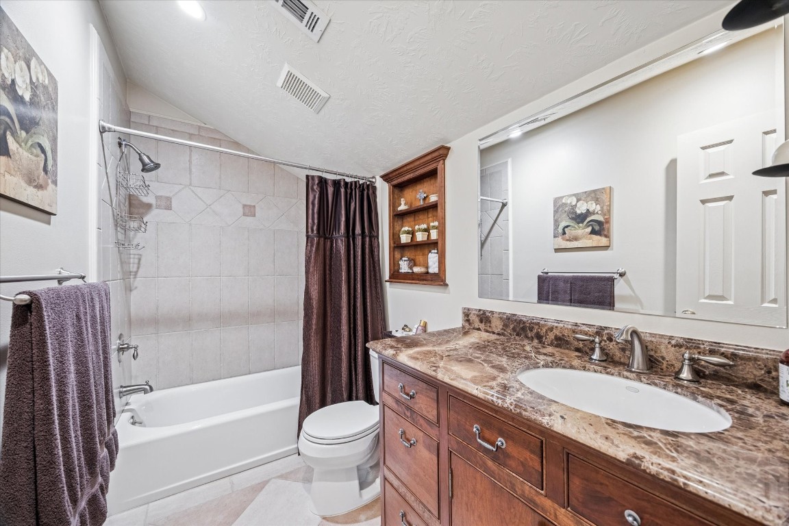 1502 Adkins Road Houston, TX 77055 - Photo 21 of 35 a bathroom with a granite countertop sink toilet and shower