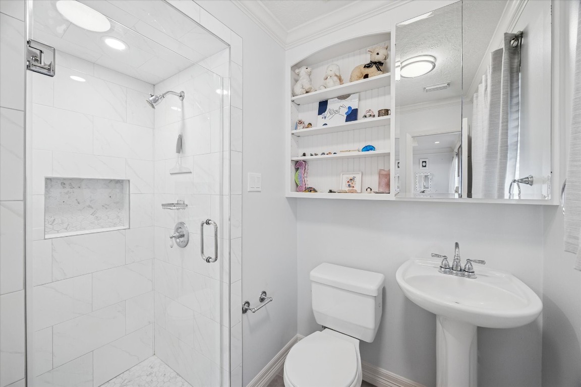 1502 Adkins Road Houston, TX 77055 - Photo 23 of 35 a bathroom with a sink toilet and shower