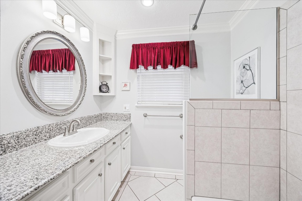 1502 Adkins Road Houston, TX 77055 - Photo 25 of 35 a bathroom with a sink and a mirror