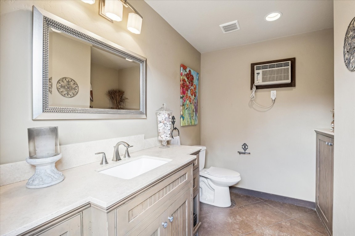 1502 Adkins Road Houston, TX 77055 - Photo 26 of 35 a bathroom with a sink vanity and toilet