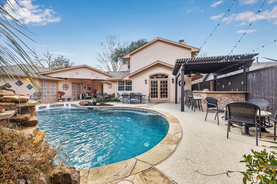 1502 Adkins Road Houston, TX 77055 - Photo 27 of 35 a view of a house with swimming pool and sitting area