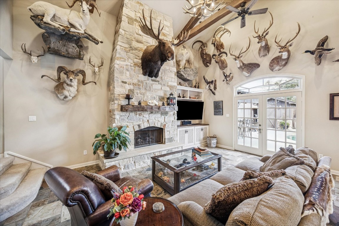 1502 Adkins Road Houston, TX 77055 - Photo 10 of 35 a living room with furniture a flat screen tv and a fireplace
