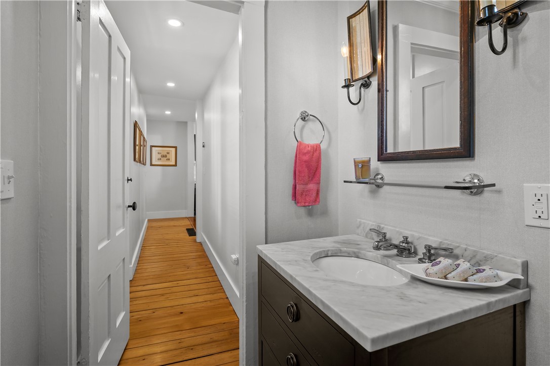 70 Mill Street Newport, RI 02840 - Photo 11 of 50 Looking down hall from powder room kitchen is to the right and living/great room is to the left.