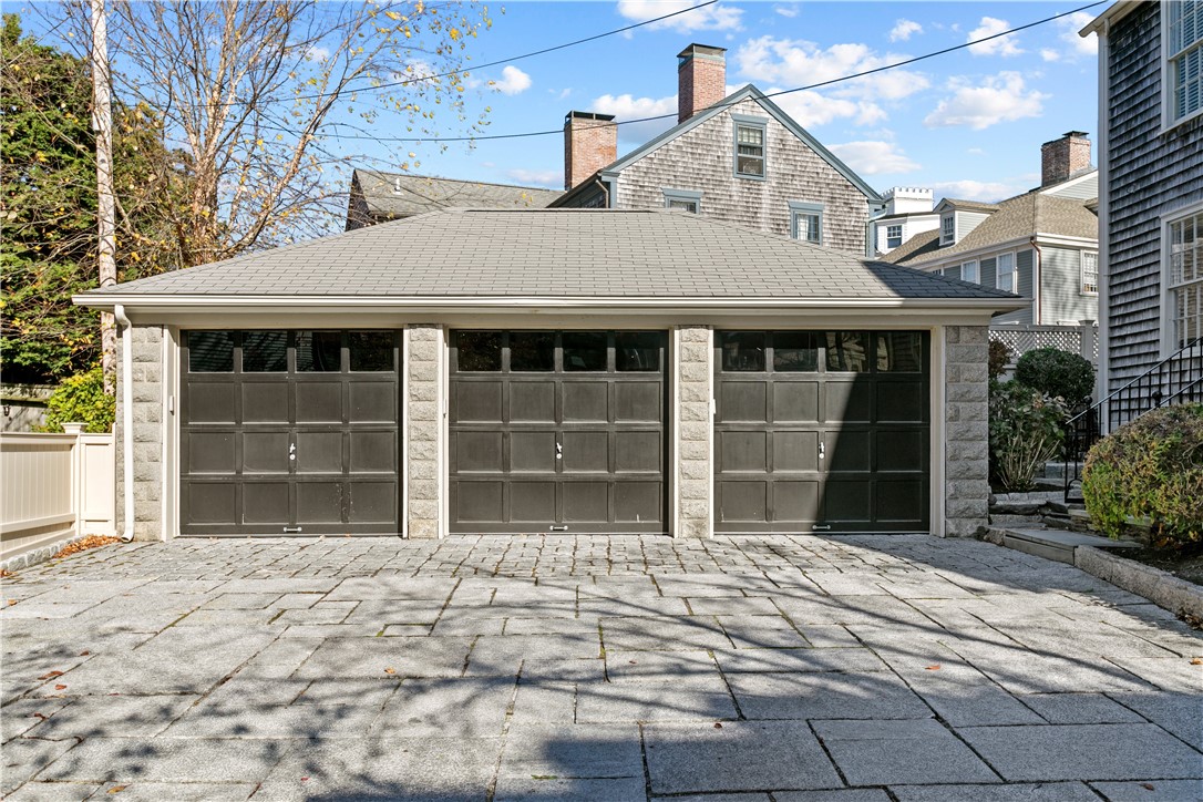 70 Mill Street Newport, RI 02840 - Photo 45 of 50 Three-car garage features new garage door openers, which can be operated remotely. Ample parking on granite driveway/courtyard. EV Level Two Electric Car charger is located off driveway.