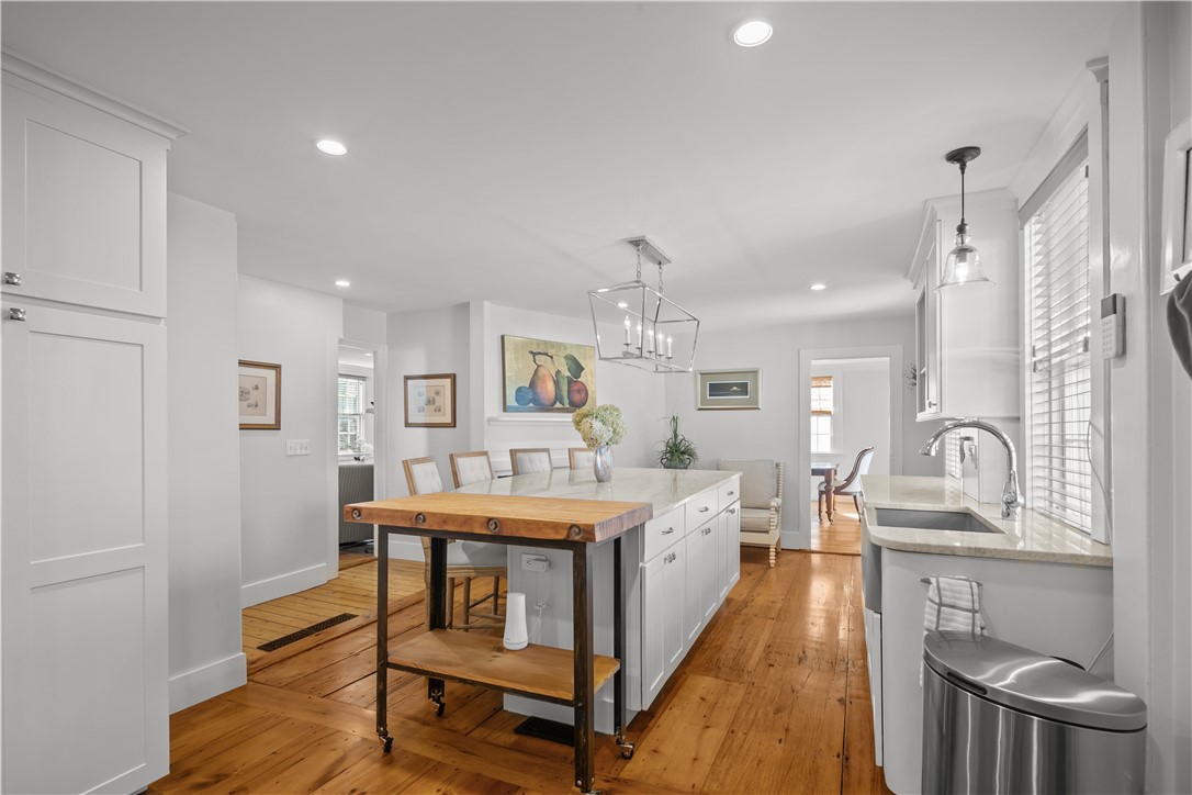 70 Mill Street Newport, RI 02840 - Photo 5 of 50 View from side door entrance. Opening at end of kitchen is to spacious dining room and to left is living/great room.