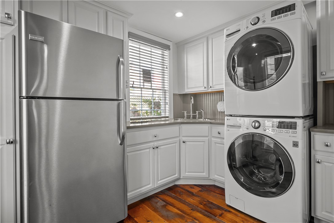 70 Mill Street Newport, RI 02840 - Photo 9 of 50 Butler's pantry and laundry room with sink and second refrigerator is located off the kitchen with door to close off from kitchen.