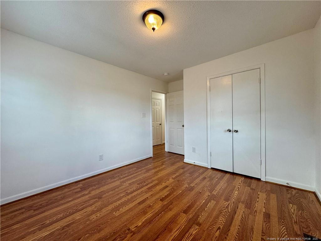 703 Odell Road Spring Lake, NC 28390 - Photo 14 of 21 a view of an empty room and wooden floor