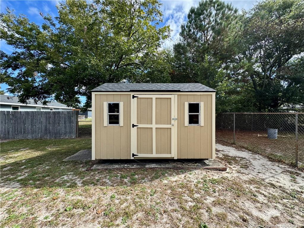 703 Odell Road Spring Lake, NC 28390 - Photo 20 of 21 a front view of a house with a yard