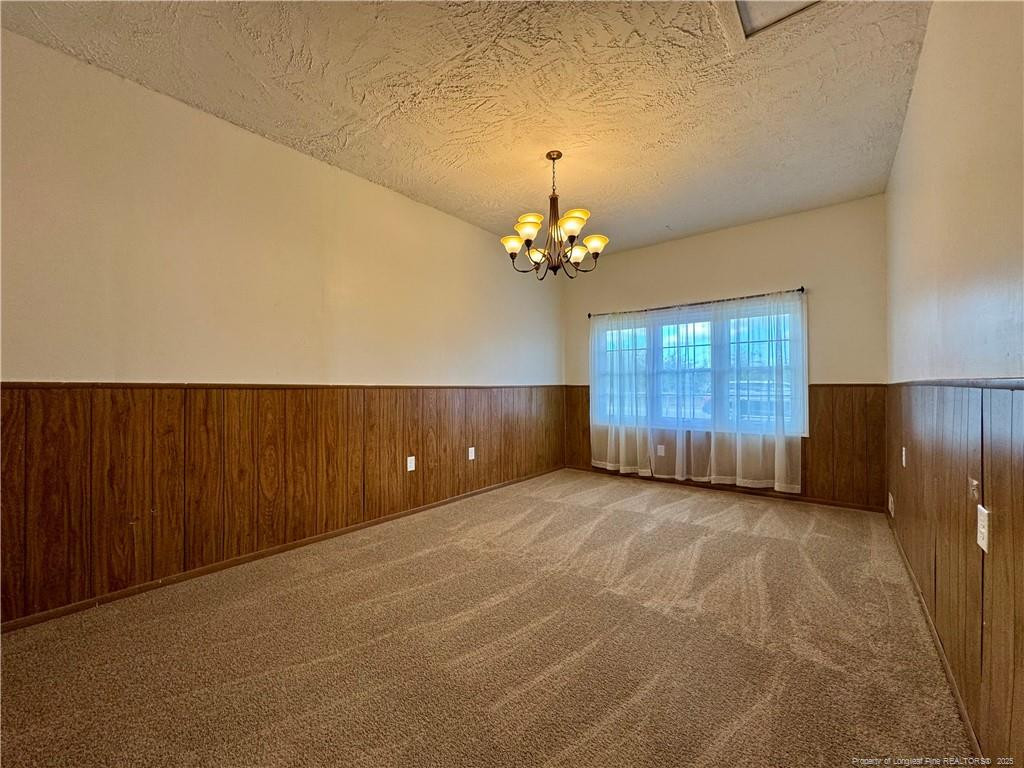 703 Odell Road Spring Lake, NC 28390 - Photo 8 of 21 a view of a livingroom with a chandelier