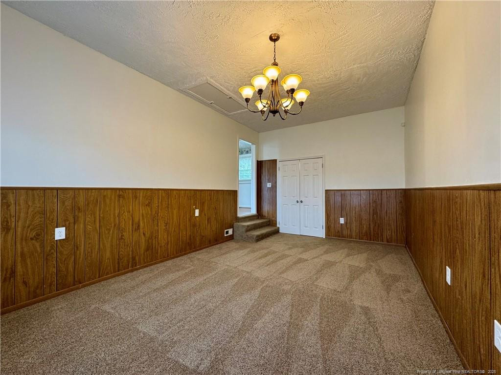 703 Odell Road Spring Lake, NC 28390 - Photo 9 of 21 a view of a livingroom with a chandelier