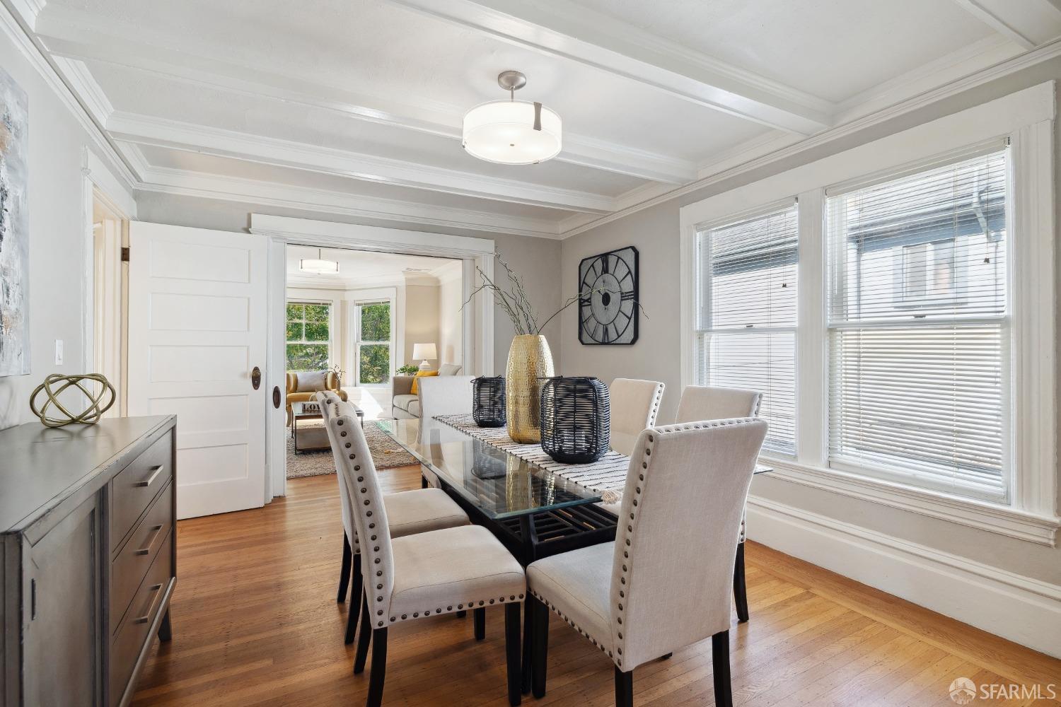 1817 Woolsey Street Berkeley, CA 94703 - Photo 12 of 35 a view of a dining room with furniture window and wooden floor