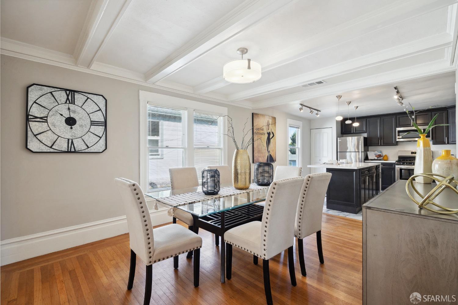 1817 Woolsey Street Berkeley, CA 94703 - Photo 13 of 35 a view of a dining room with furniture window and wooden floor