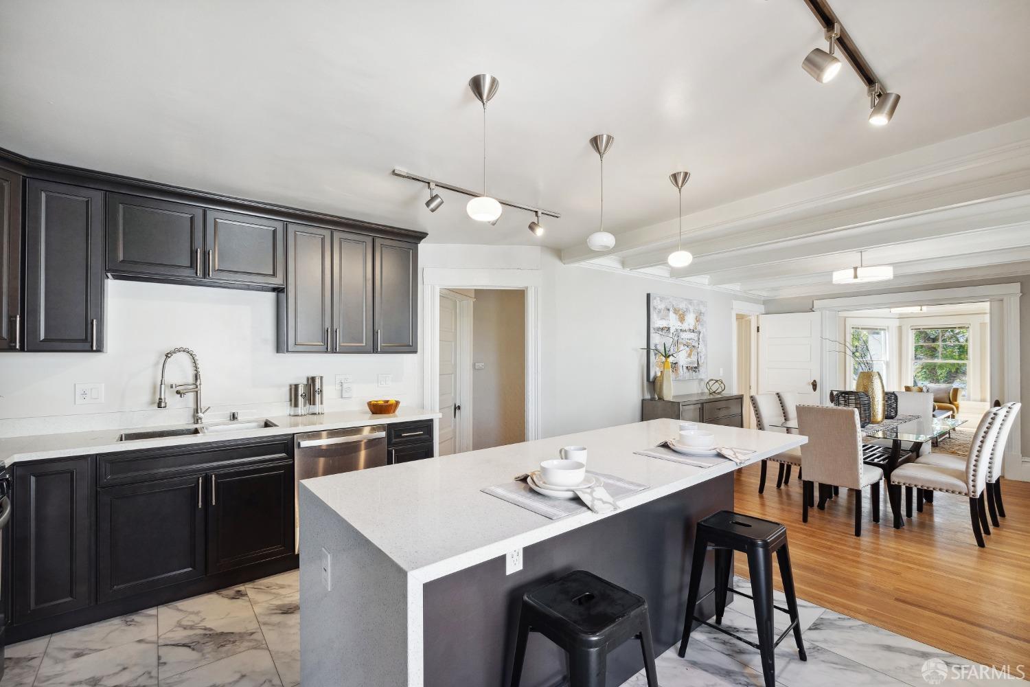 1817 Woolsey Street Berkeley, CA 94703 - Photo 18 of 35 a large kitchen with a table and chairs