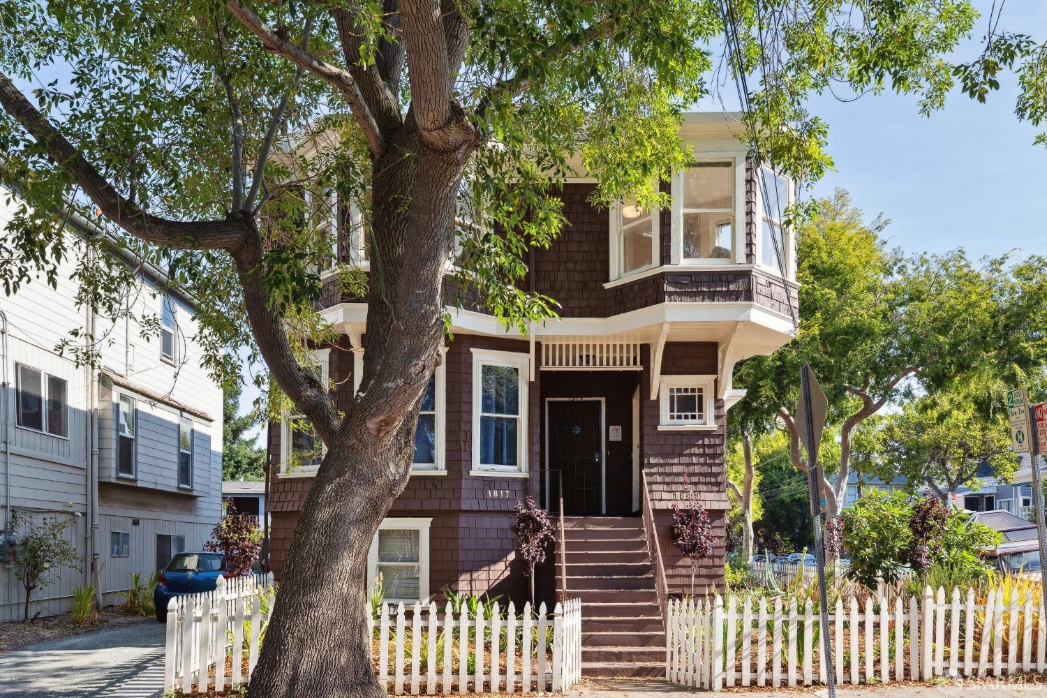1817 Woolsey Street Berkeley, CA 94703 - Photo 2 of 35 a front view of a house with a tree