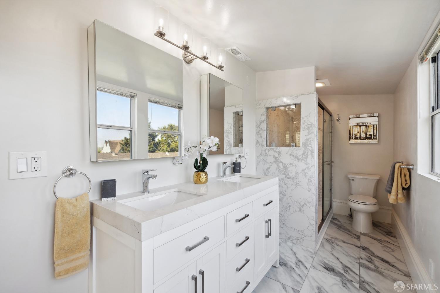 1817 Woolsey Street Berkeley, CA 94703 - Photo 24 of 35 a bathroom with a sink a toilet a mirror and shower