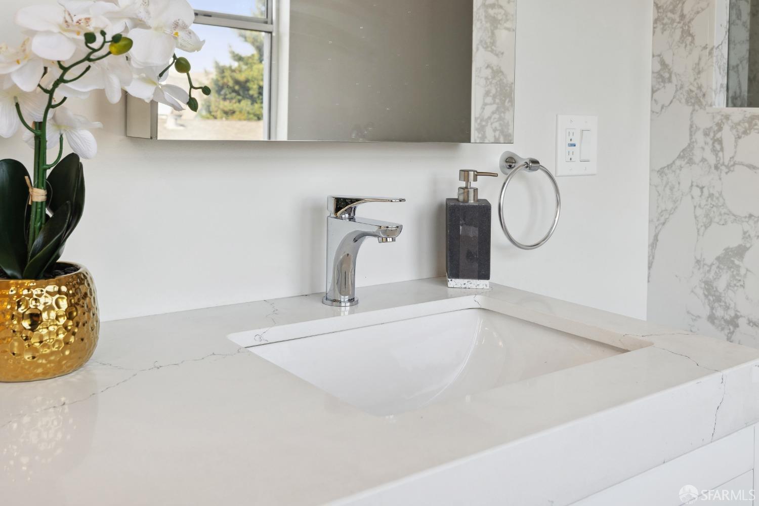 1817 Woolsey Street Berkeley, CA 94703 - Photo 25 of 35 a bathroom with a granite countertop sink and a mirror