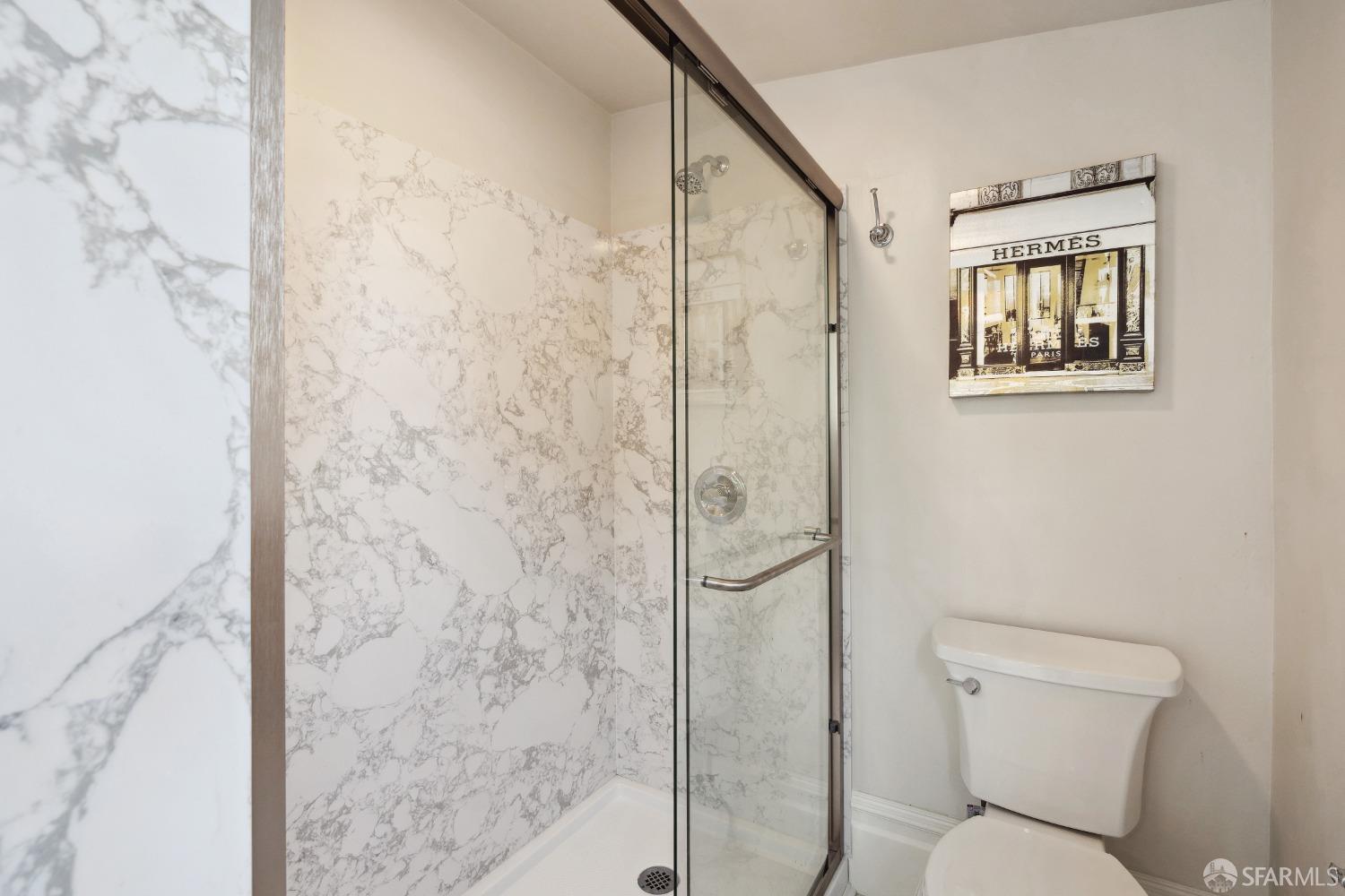 1817 Woolsey Street Berkeley, CA 94703 - Photo 26 of 35 a bathroom with a toilet and shower