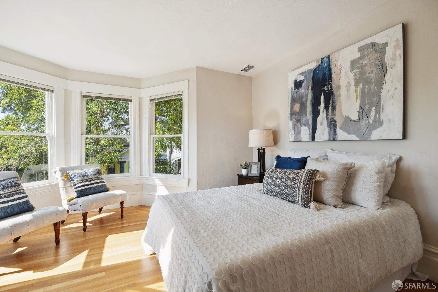 1817 Woolsey Street Berkeley, CA 94703 - Photo 28 of 35 a bedroom with a large bed and a large window