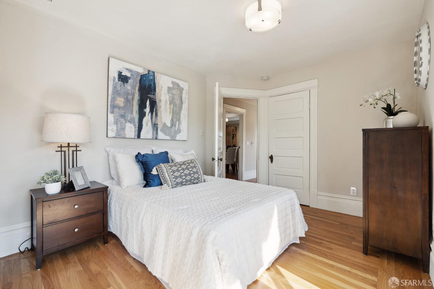 1817 Woolsey Street Berkeley, CA 94703 - Photo 30 of 35 a bedroom with a bed and a table