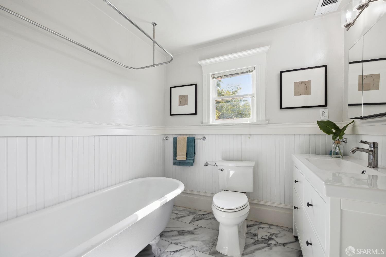 1817 Woolsey Street Berkeley, CA 94703 - Photo 31 of 35 a bathroom with a toilet sink and bathtub