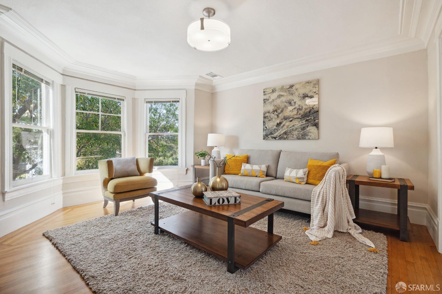 1817 Woolsey Street Berkeley, CA 94703 - Photo 7 of 35 a living room with furniture wooden floor and a large window