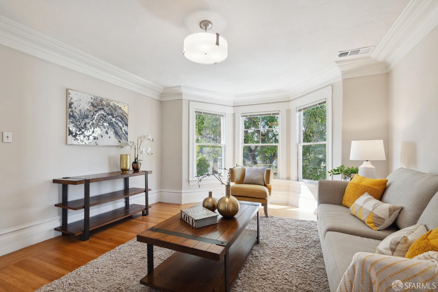1817 Woolsey Street Berkeley, CA 94703 - Photo 8 of 35 a living room with furniture a rug and a large window
