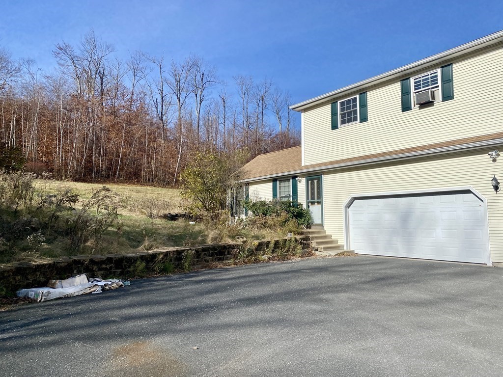 54 Holcomb Road Chester, MA 01011 - Photo 3 of 25 a view of a house with a yard