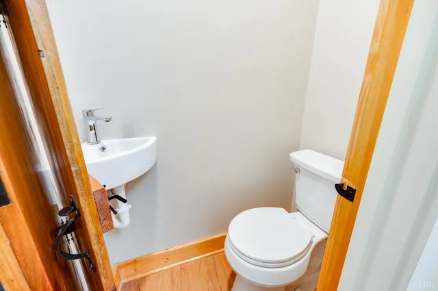 a spacious bedroom with a bed couch and a window