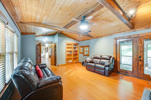 a dining room with furniture a window and wooden floor
