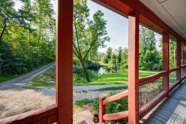 a white toilet sitting next to a bathroom sink and a window